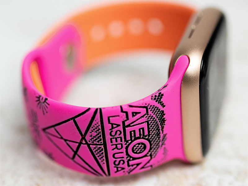 custom fluorecent pink watch band with 摄影写真 logo engraved on it